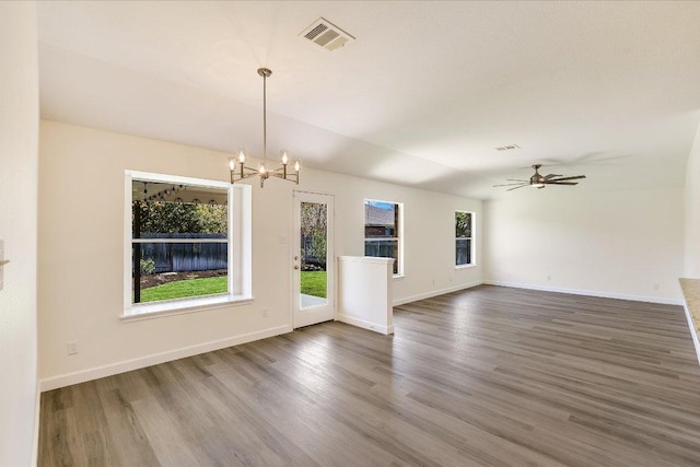 3905 Stonehenge Path, Round Rock, TX 78681 - unfurnished living room featuring a chandelier, wood finished floors, ceiling fan, and baseboards