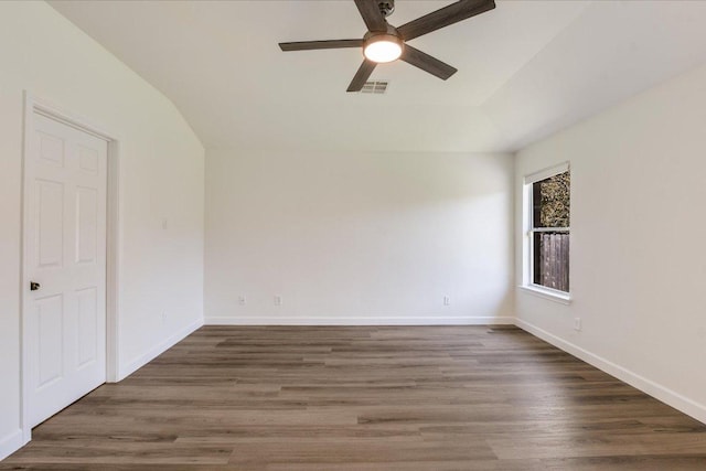 3905 Stonehenge Path, Round Rock, TX 78681 - unfurnished bedroom with wood finished floors, vaulted ceiling, and ceiling fan