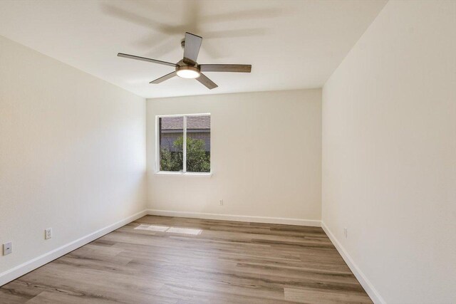 3905 Stonehenge Path, Round Rock, TX 78681 - spare room featuring ceiling fan, wood finished floors, and baseboards