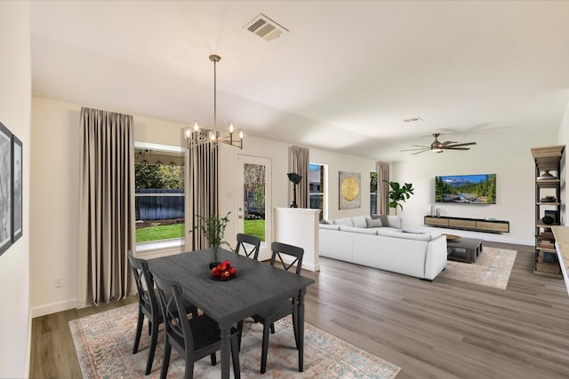 3905 Stonehenge Path, Round Rock, TX 78681 - dining space featuring a chandelier, wood finished floors, a ceiling fan, and baseboards