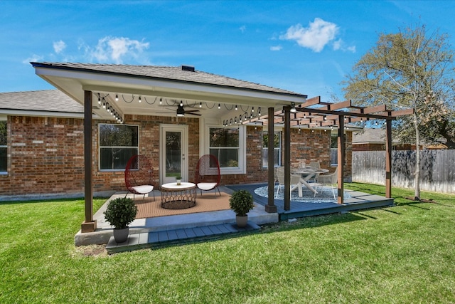 3905 Stonehenge Path, Round Rock, TX 78681 - back of property featuring ceiling fan, a pergola, a wooden deck, brick siding, and a shingled roof