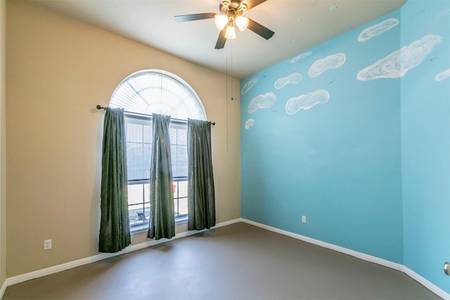 254 Chisholm Trl, Bastrop, TX 78602 - empty room with a ceiling fan and finished concrete flooring