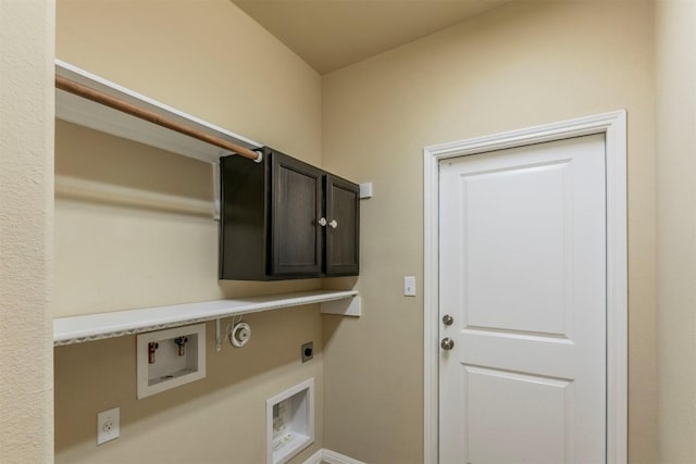 254 Chisholm Trl, Bastrop, TX 78602 - laundry room featuring electric dryer hookup, cabinet space, gas dryer hookup, and washer hookup