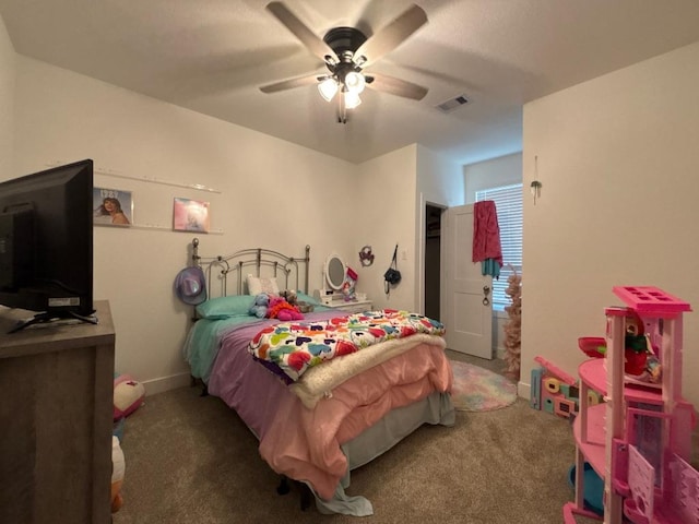 2905 Lago Costa Dr, La Marque, TX 77568 - carpeted bedroom featuring a ceiling fan and baseboards
