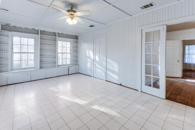 2710 Enfield Rd, Austin, TX 78703 - unfurnished room with ceiling fan, visible vents, and built in shelves