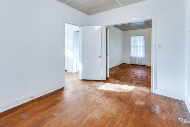 2710 Enfield Rd, Austin, TX 78703 - spare room featuring wood-type flooring, ornamental molding, and baseboards