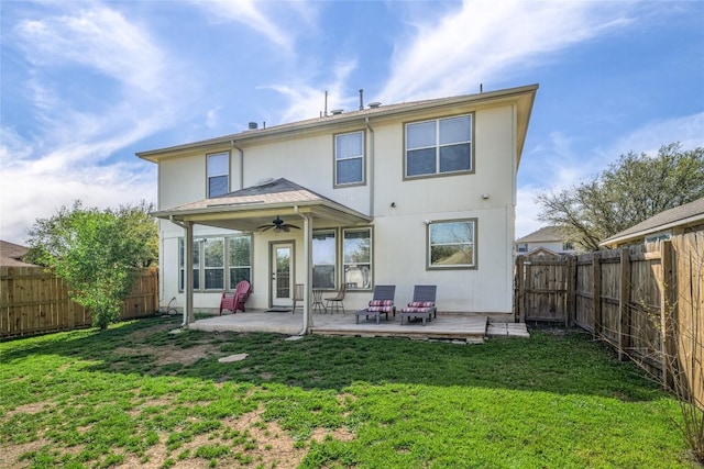 106 Remington Run, Bastrop, TX 78602 - rear view of house with ceiling fan, a fenced backyard, and a patio area