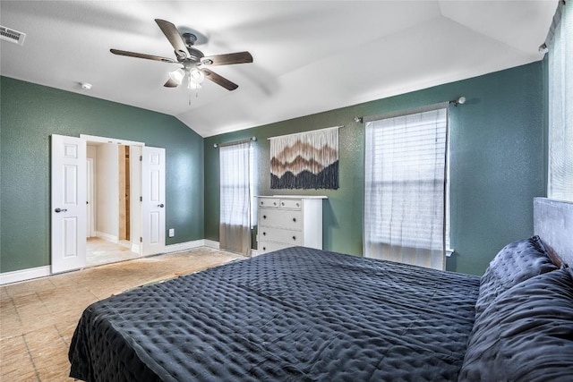 106 Remington Run, Bastrop, TX 78602 - bedroom with lofted ceiling, a textured wall, and ceiling fan