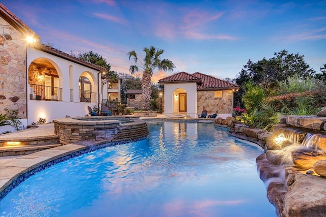 outdoor pool with an in ground hot tub