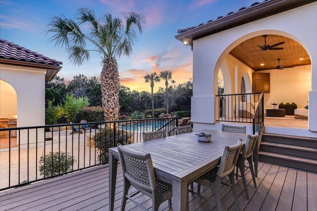 3312 Pearce Rd, Austin, TX 78730 - deck at dusk with a ceiling fan, an outdoor pool, and area for grilling