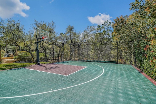 view of sport court featuring basketball hoop
