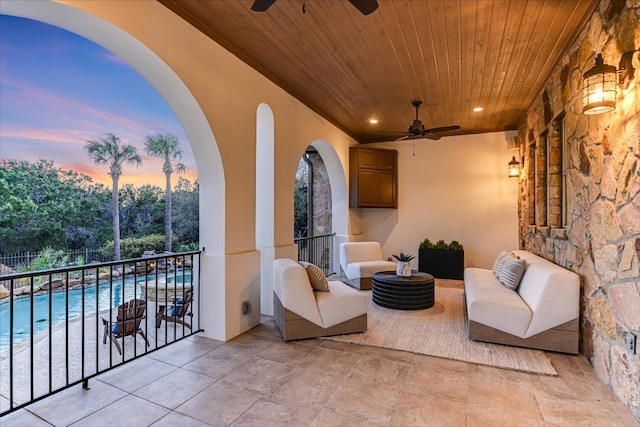 living area featuring wooden ceiling, recessed lighting, and a ceiling fan