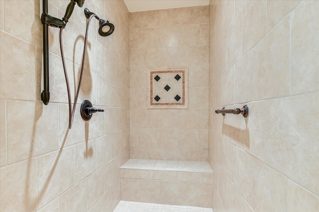 full bathroom featuring tiled shower