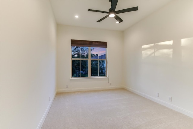 unfurnished room featuring light carpet, recessed lighting, baseboards, and a ceiling fan