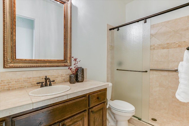 full bath featuring decorative backsplash, a shower stall, toilet, and vanity