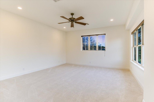 unfurnished room with light colored carpet, recessed lighting, baseboards, and ceiling fan