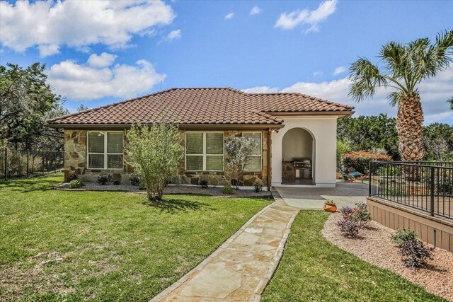 3312 Pearce Rd, Austin, TX 78730 - back of property with stone siding, a tiled roof, and stucco siding