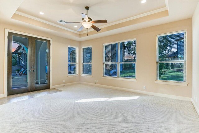 3312 Pearce Rd, Austin, TX 78730 - carpeted empty room with a tray ceiling, crown molding, french doors, plenty of natural light, and a ceiling fan