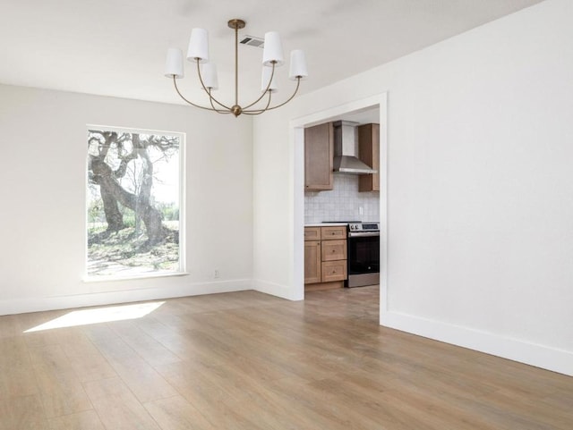 1403 E Applegate Dr, Austin, TX 78753 - unfurnished dining area with a chandelier, light wood-type flooring, and baseboards