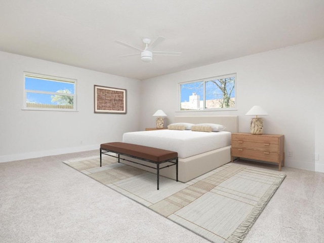 1403 E Applegate Dr, Austin, TX 78753 - bedroom with light colored carpet, multiple windows, baseboards, and ceiling fan