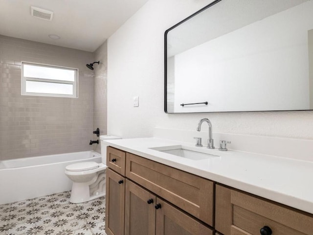 1403 E Applegate Dr, Austin, TX 78753 - bathroom featuring toilet, vanity, bathtub / shower combination, and tile patterned floors
