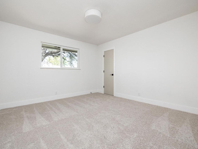 1403 E Applegate Dr, Austin, TX 78753 - spare room featuring carpet flooring and baseboards