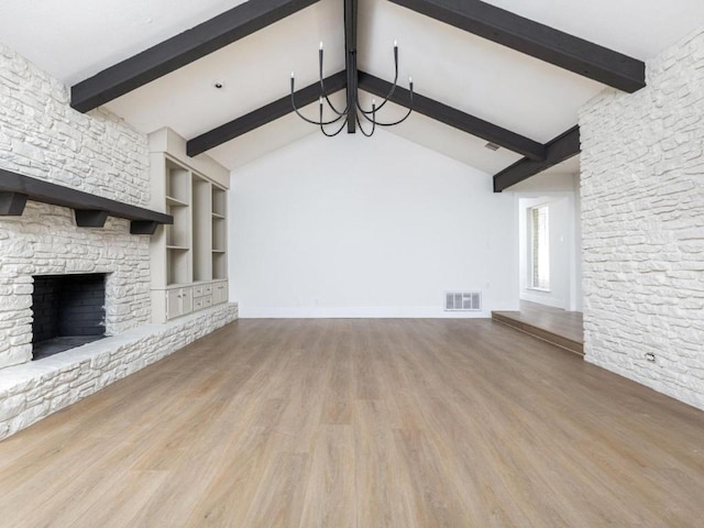 1403 E Applegate Dr, Austin, TX 78753 - unfurnished living room featuring a chandelier, a fireplace, wood finished floors, and baseboards