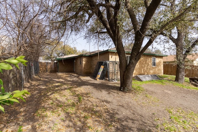exterior space with a fenced backyard