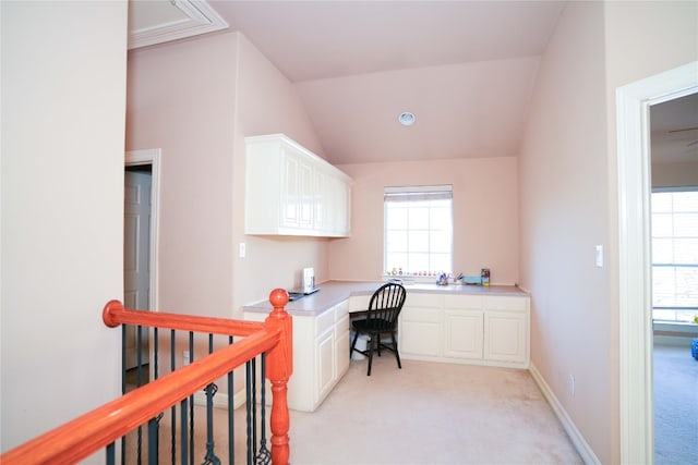 11608 Spicewood Pkwy Unit 38, Austin, TX 78750 - home office featuring built in desk, light carpet, healthy amount of natural light, and lofted ceiling