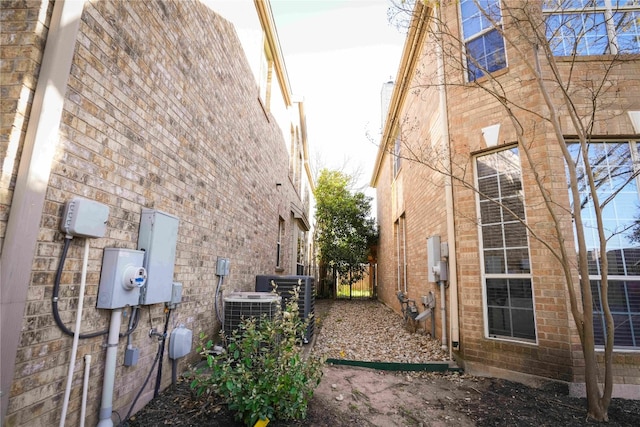 11608 Spicewood Pkwy Unit 38, Austin, TX 78750 - view of side of property featuring a central air condition unit and brick siding