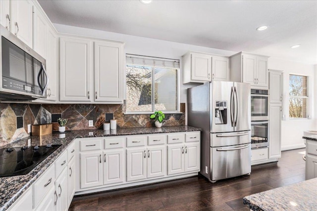 kitchen featuring stainless steel appliances, plenty of natural light, white cabinets, and recessed lighting