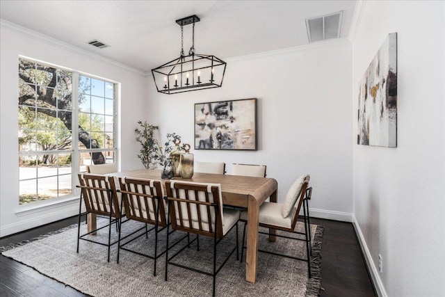 12413 Fairfax Ridge Pl, Austin, TX 78738 - dining area featuring ornamental molding, baseboards, dark wood-style flooring, and a chandelier