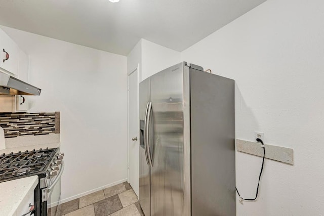 8610 Croydon Loop, Austin, TX 78748 - kitchen with stainless steel appliances, baseboards, white cabinetry, backsplash, and under cabinet range hood