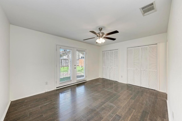 8610 Croydon Loop, Austin, TX 78748 - unfurnished bedroom featuring access to exterior, french doors, two closets, wood finished floors, and visible vents