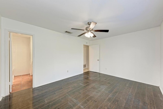 8610 Croydon Loop, Austin, TX 78748 - unfurnished room with a ceiling fan, baseboards, visible vents, and dark wood finished floors