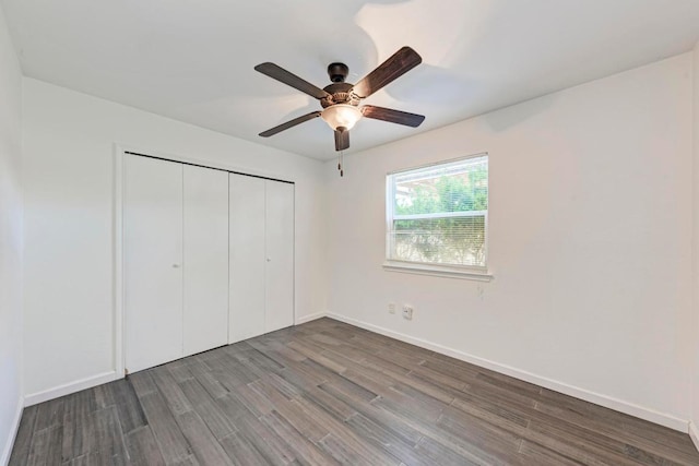 8610 Croydon Loop, Austin, TX 78748 - unfurnished bedroom with baseboards, ceiling fan, wood finished floors, and a closet