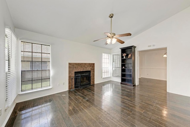 8610 Croydon Loop, Austin, TX 78748 - unfurnished living room featuring ceiling fan, wood finished floors, lofted ceiling, and a tiled fireplace