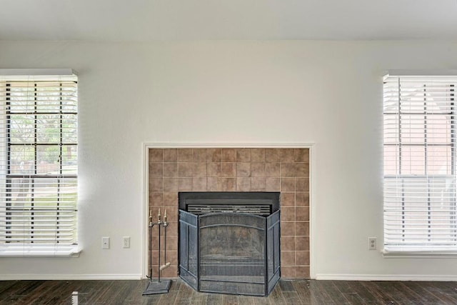 8610 Croydon Loop, Austin, TX 78748 - detailed view of wood finished floors and a tiled fireplace