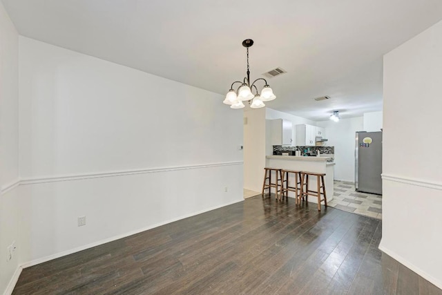 8610 Croydon Loop, Austin, TX 78748 - living area with a chandelier and dark wood-style floors
