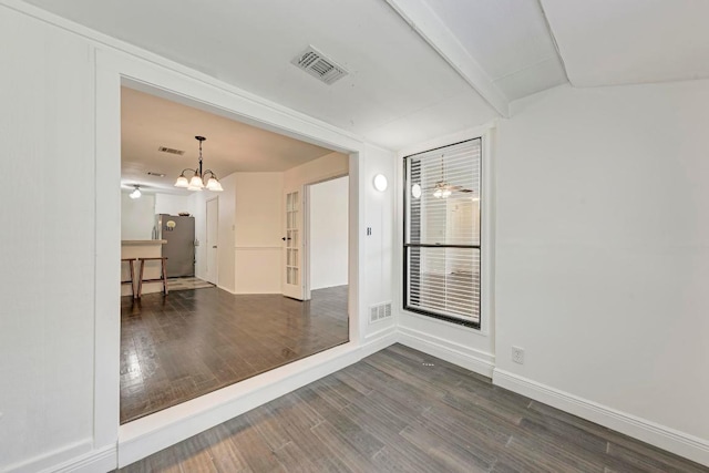 8610 Croydon Loop, Austin, TX 78748 - spare room featuring wood finished floors and a chandelier