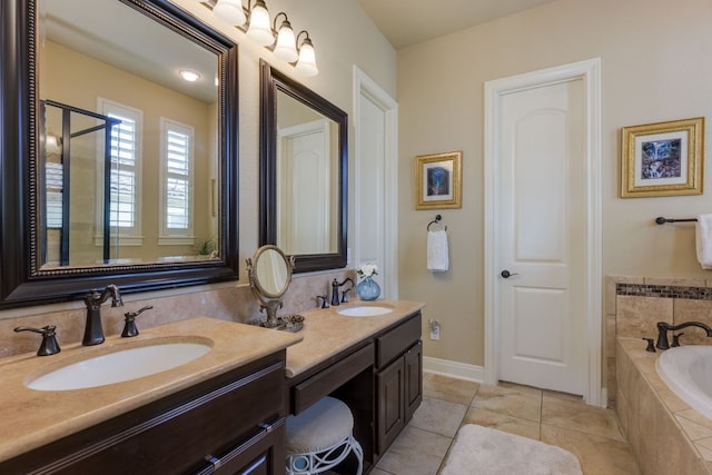 bathroom with a garden tub, a sink, tile patterned flooring, and double vanity
