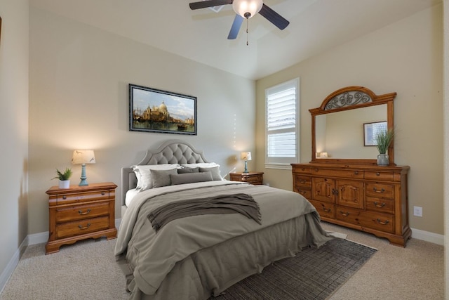 bedroom featuring baseboards, a ceiling fan, and light carpet