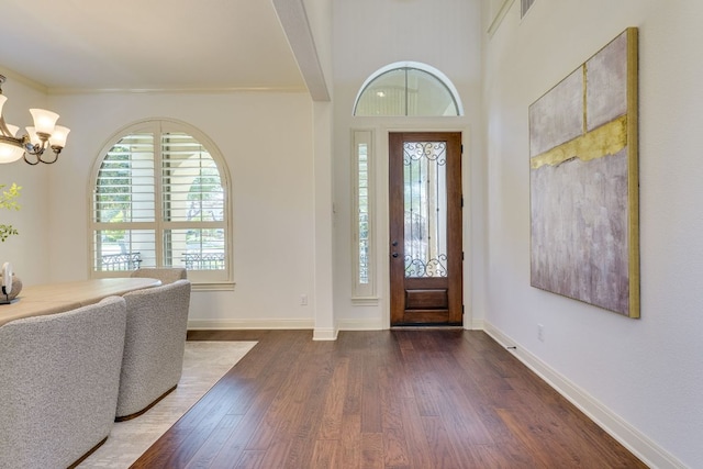 11521 Shadestone Ter, Austin, TX 78732 - foyer entrance with wood finished floors and a chandelier