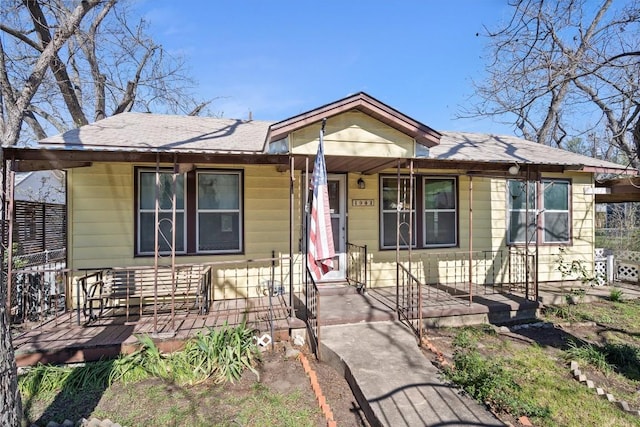 bungalow with a shingled roof
