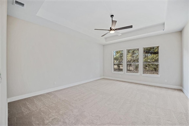 390 Crosswater Ln, Dripping Springs, TX 78620 - unfurnished room with a raised ceiling, a ceiling fan, carpet, and baseboards