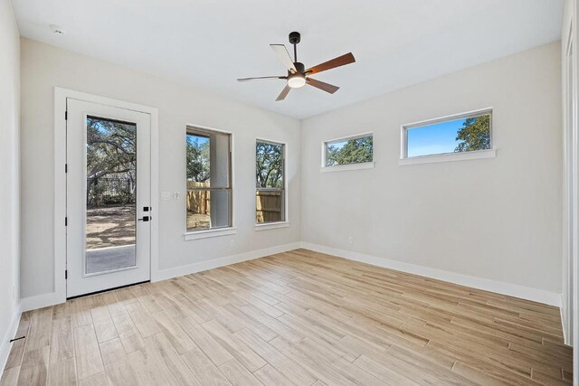 390 Crosswater Ln, Dripping Springs, TX 78620 - unfurnished room with light wood-style flooring, ceiling fan, and baseboards