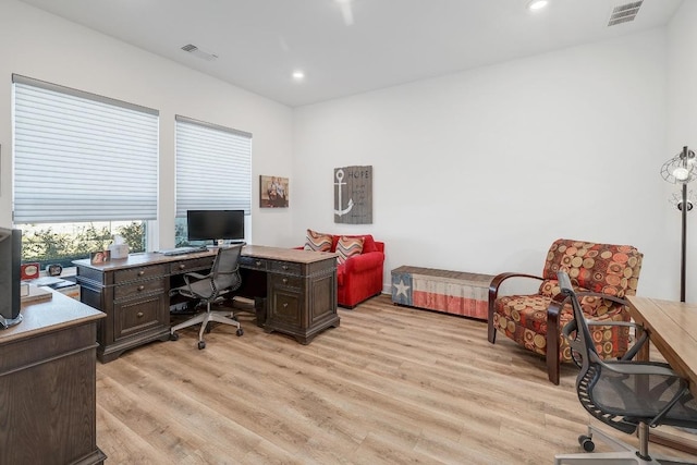 office area with recessed lighting, visible vents, and light wood-style flooring