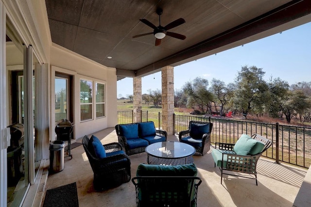 view of patio featuring outdoor lounge area and ceiling fan
