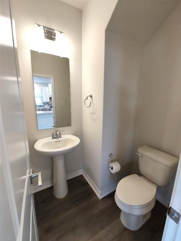 4336 Trey Edsel Dr, Pflugerville, TX 78660 - half bathroom with toilet and wood finished floors