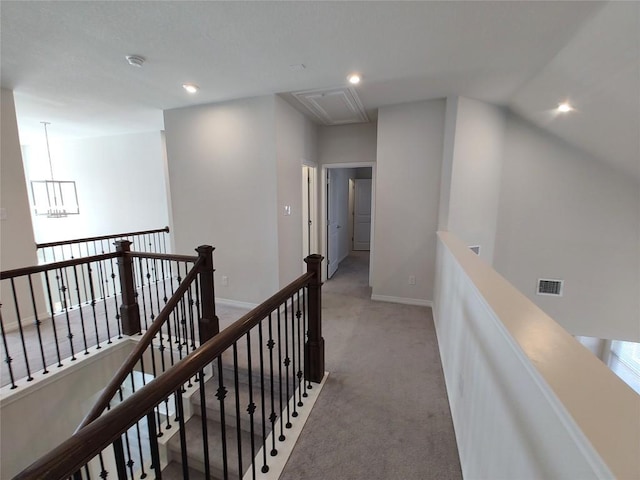 4336 Trey Edsel Dr, Pflugerville, TX 78660 - corridor with an upstairs landing, attic access, carpet floors, recessed lighting, and a chandelier